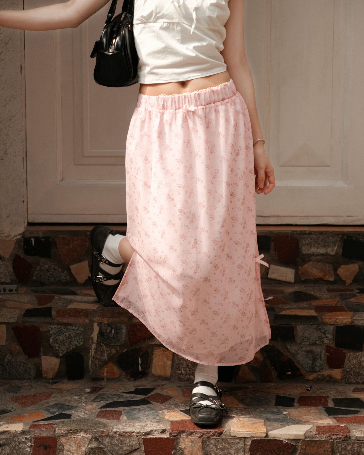 close up of a girl wearing cute pink skirt